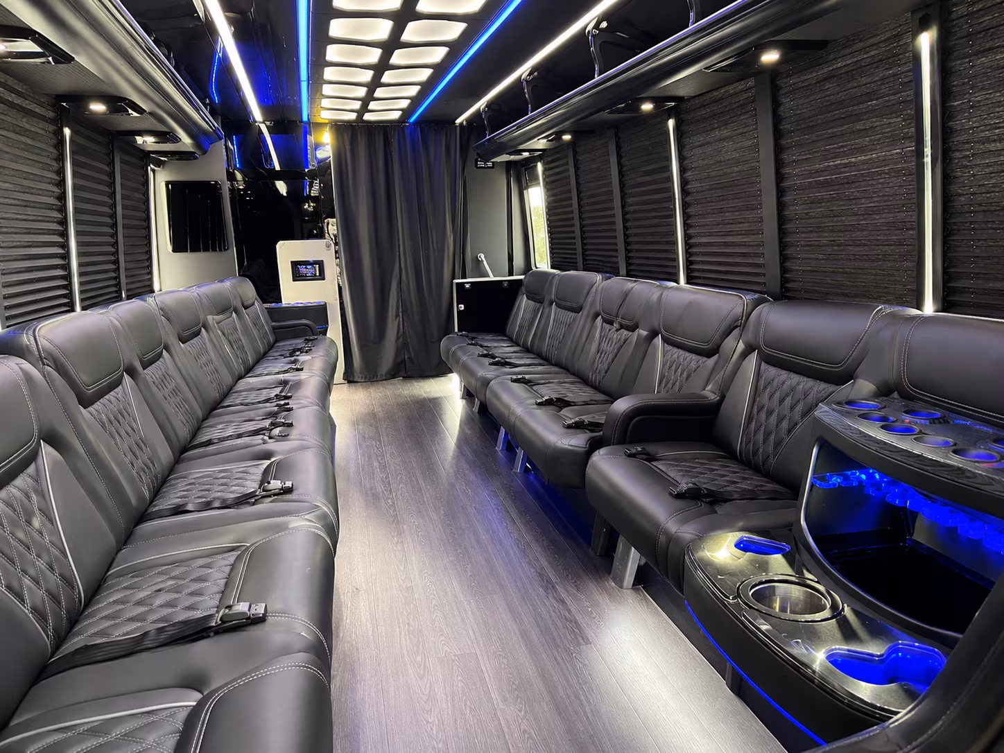 Wedding guests seated inside a party bus serving Newport News